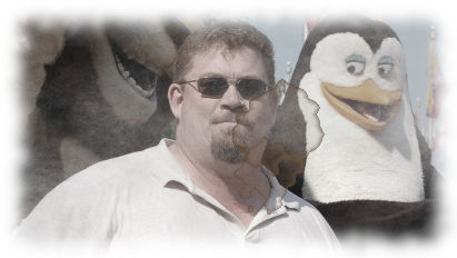 Coffee stained, grainy, fuzzy-bordered photo of Big Country Expat being eyed by a penguin